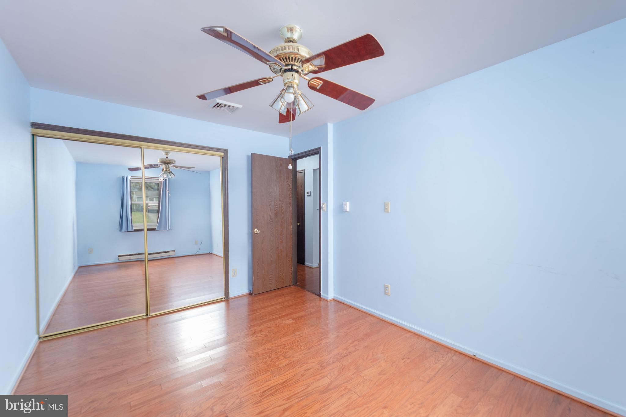 17 Turnbridge Drive Lancaster, PA 17603 - Photo 3 of 32 wooden floor in an empty room with a window