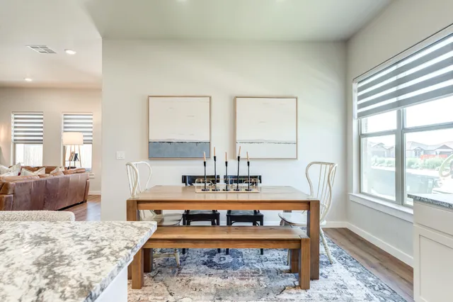 a view of dining room with furniture and window