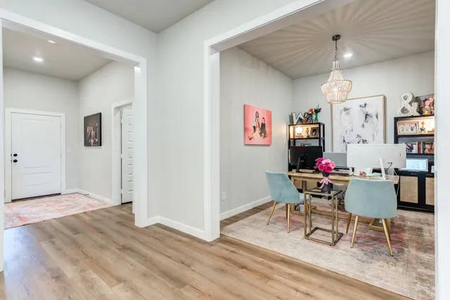 a workspace with furniture and wooden floor