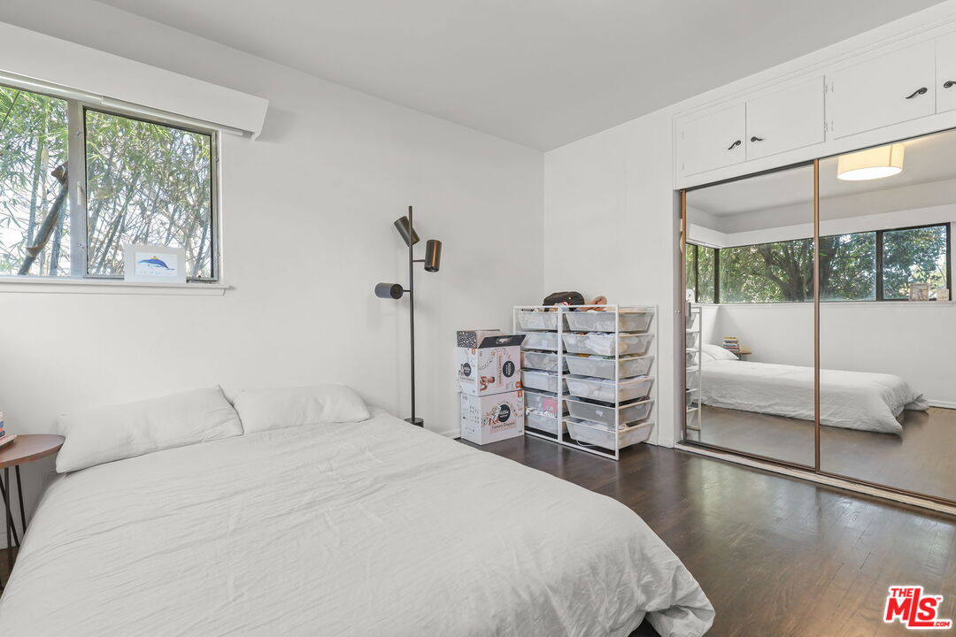 3765 Arbolada Road Los Angeles, CA 90027 - Photo 13 of 34 a bedroom with a large bed and a window