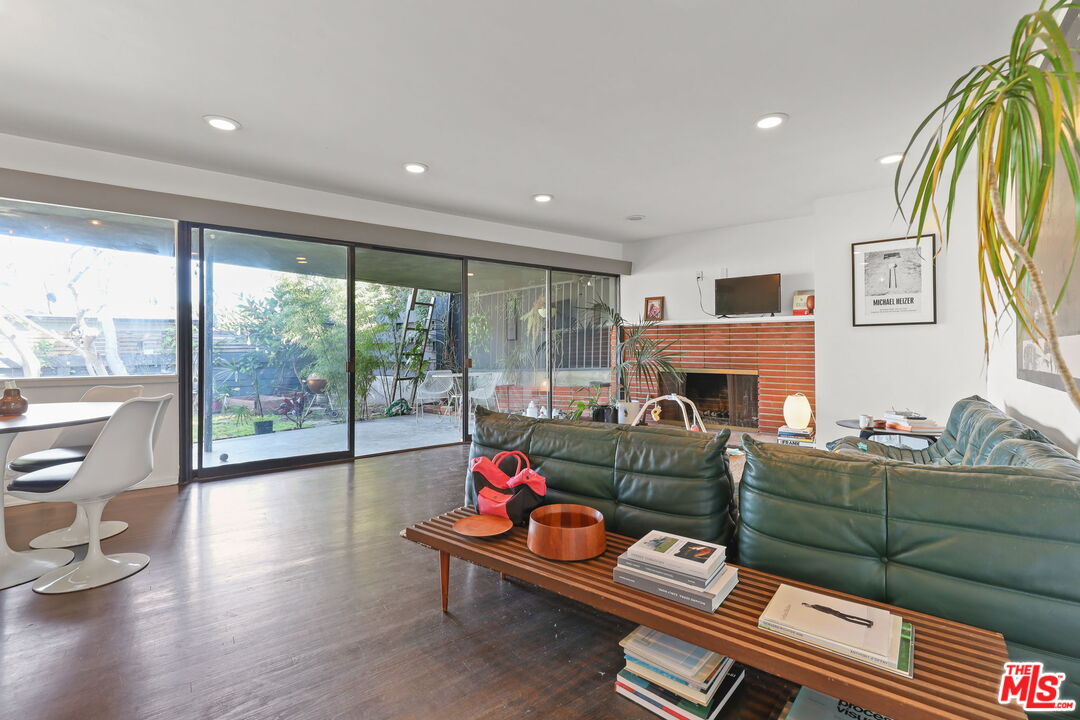 3765 Arbolada Road Los Angeles, CA 90027 - Photo 2 of 34 a living room with furniture fireplace and flat screen tv