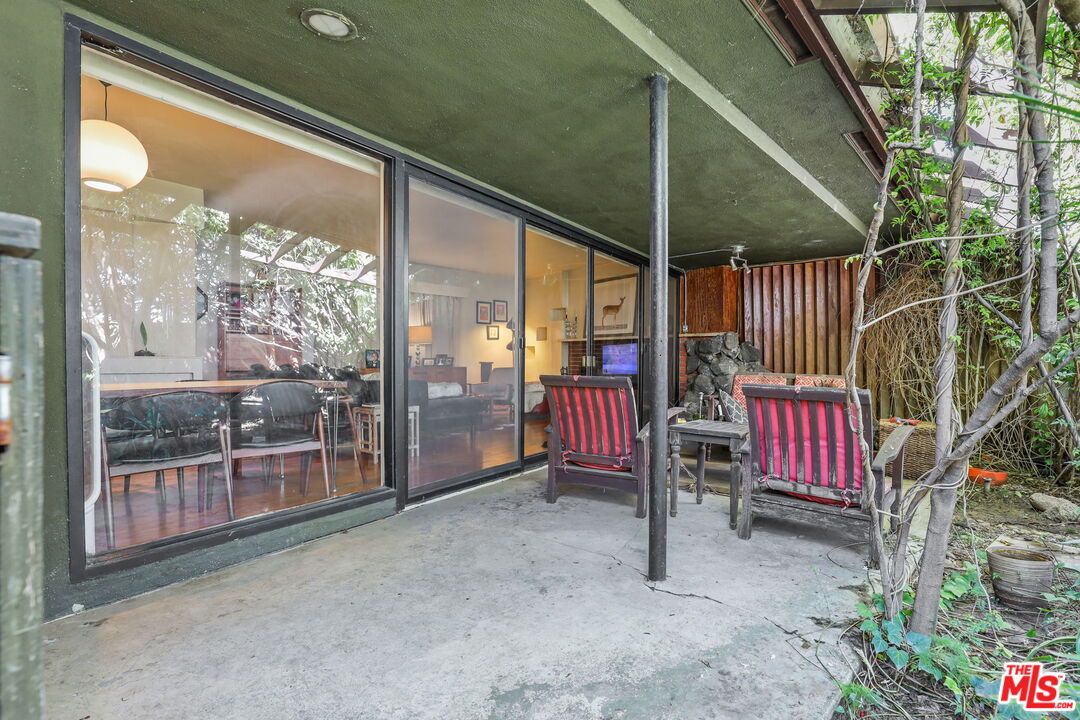 3765 Arbolada Road Los Angeles, CA 90027 - Photo 26 of 34 a view of an outdoor space with wooden floor and outdoor seating