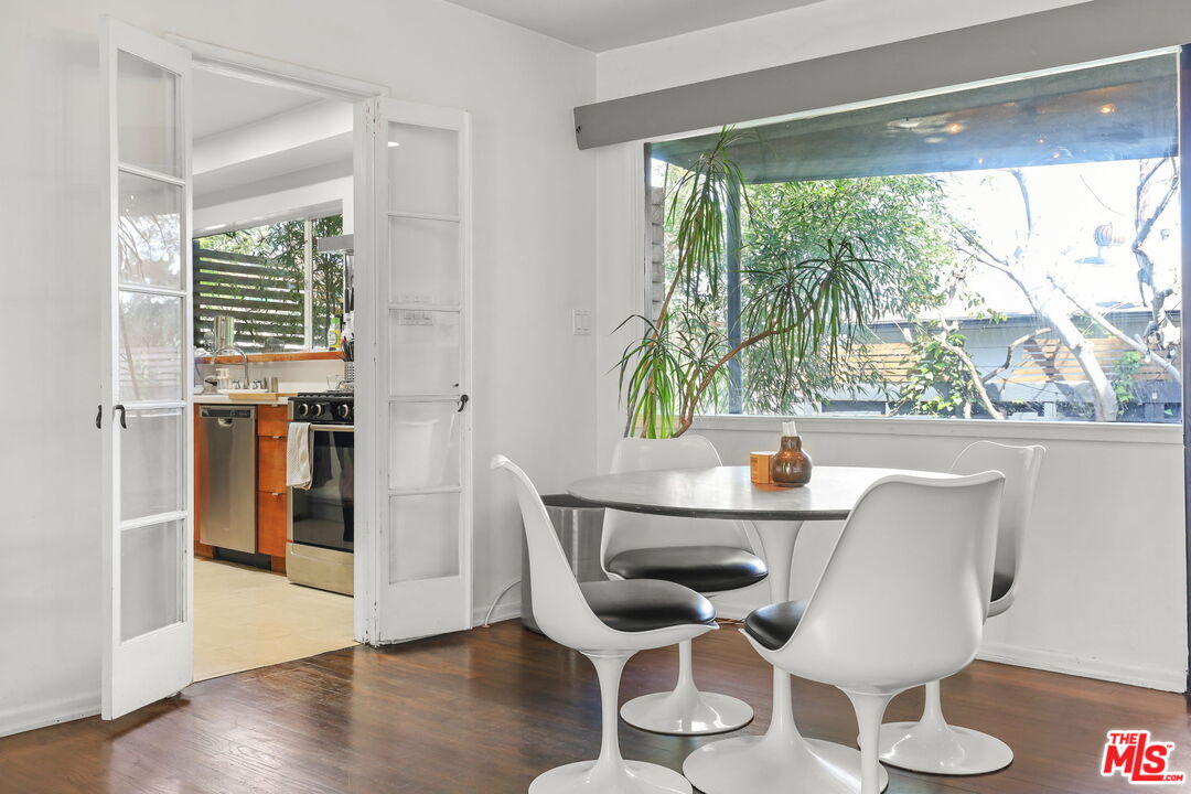 3765 Arbolada Road Los Angeles, CA 90027 - Photo 7 of 34 a dining room with furniture and wooden floor