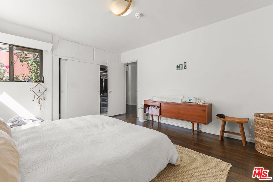 3765 Arbolada Road Los Angeles, CA 90027 - Photo 9 of 34 a bedroom with a bed a table and chair