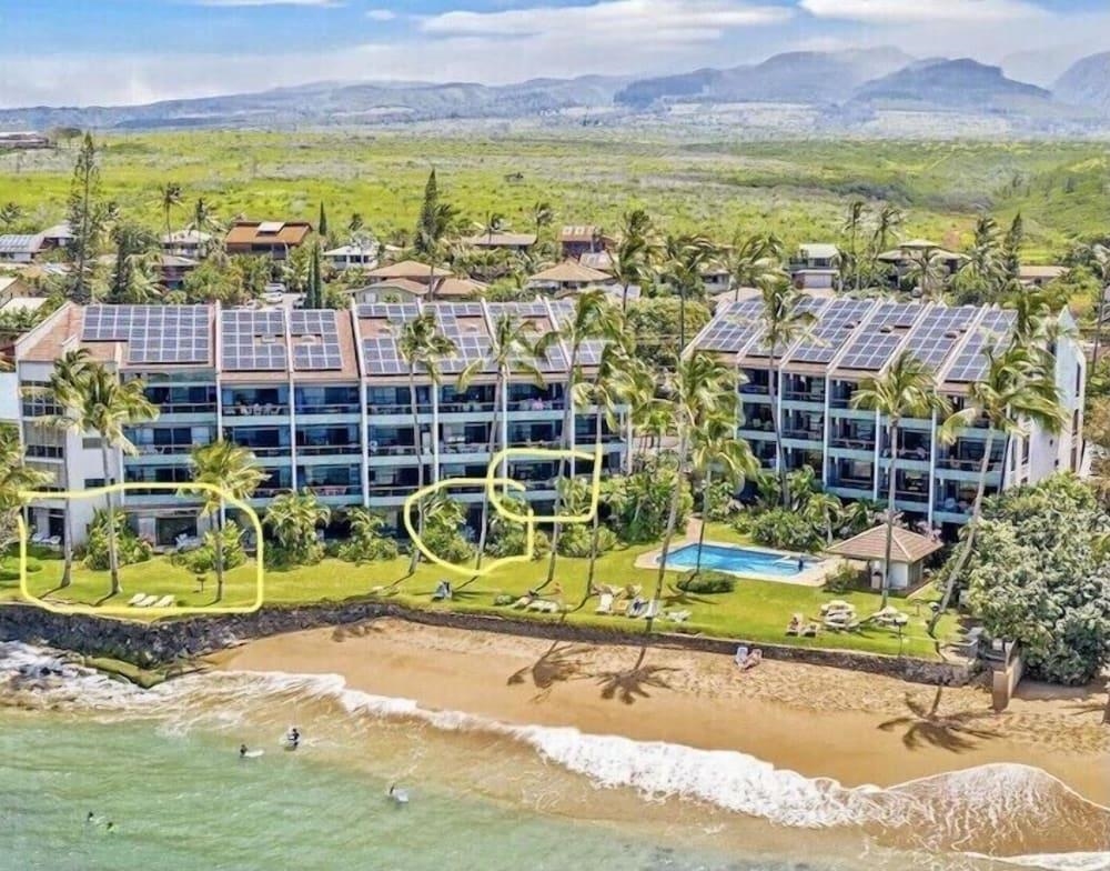 3875 Lower Honoapiilani Road, Unit A105 Lahaina, HI 96761 - Photo 21 of 27 an aerial view of residential houses with outdoor space and swimming pool