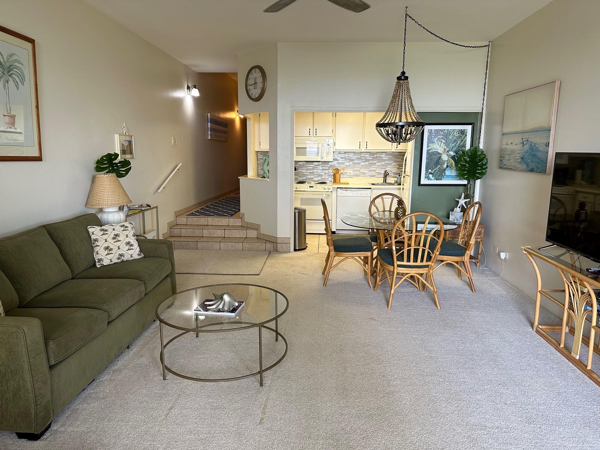 3875 Lower Honoapiilani Road, Unit A105 Lahaina, HI 96761 - Photo 6 of 27 a living room with furniture and a floor to ceiling window