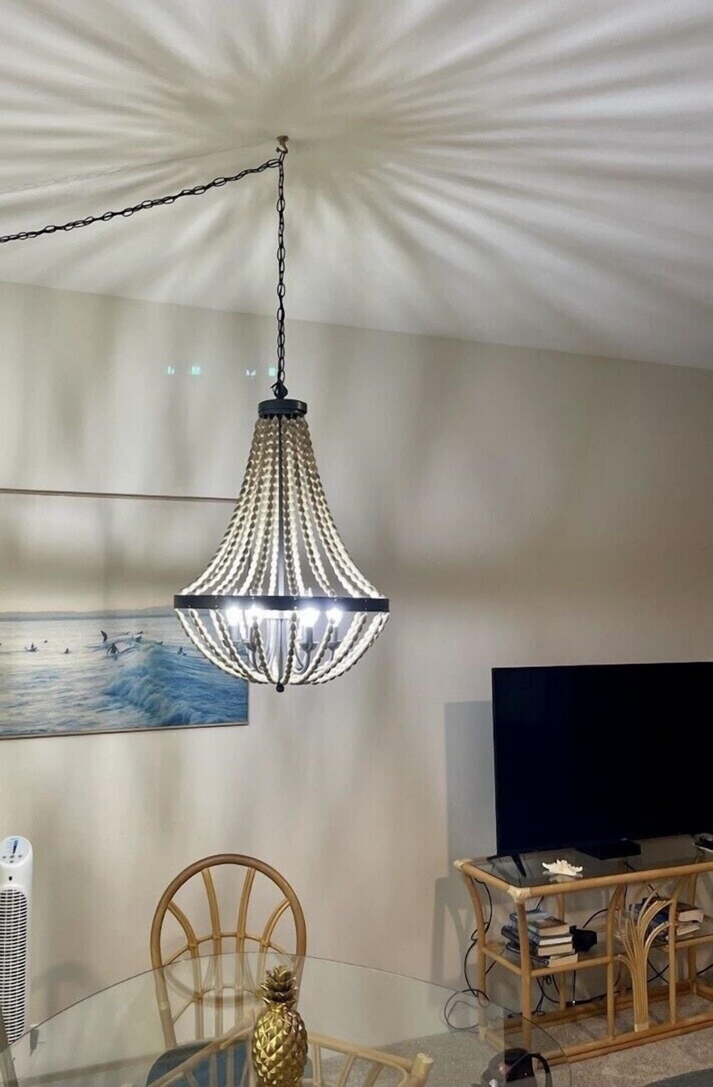 3875 Lower Honoapiilani Road, Unit A105 Lahaina, HI 96761 - Photo 9 of 27 a bedroom with a flat screen tv and a ceiling fan