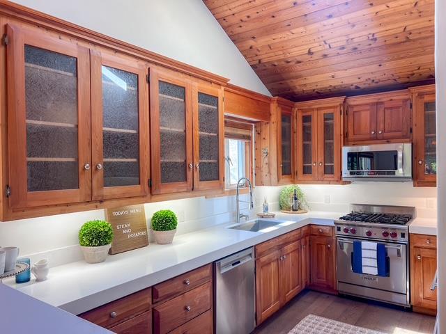 442 Corral De Tierra Road Salinas, CA 93908 - Photo 13 of 48 a kitchen with stainless steel appliances granite countertop a sink and a stove