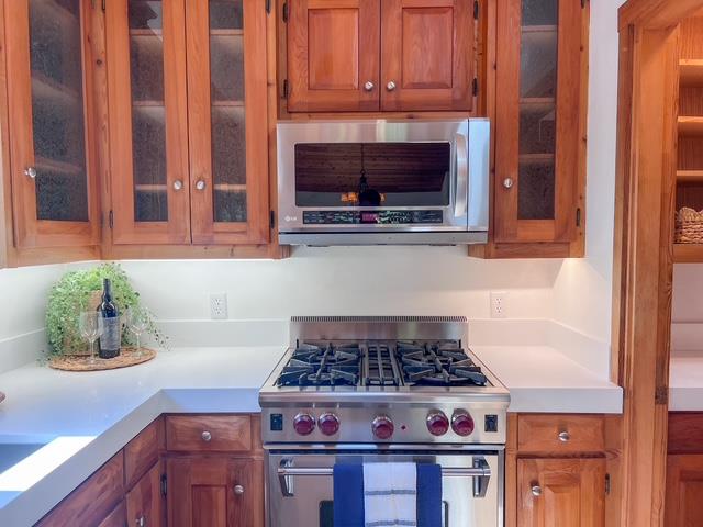 442 Corral De Tierra Road Salinas, CA 93908 - Photo 14 of 48 a kitchen with granite countertop a stove and a microwave