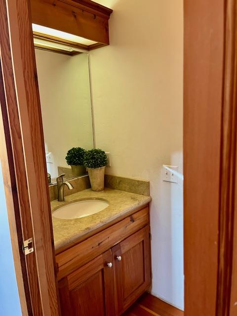 442 Corral De Tierra Road Salinas, CA 93908 - Photo 20 of 48 a bathroom with a granite countertop sink and a mirror