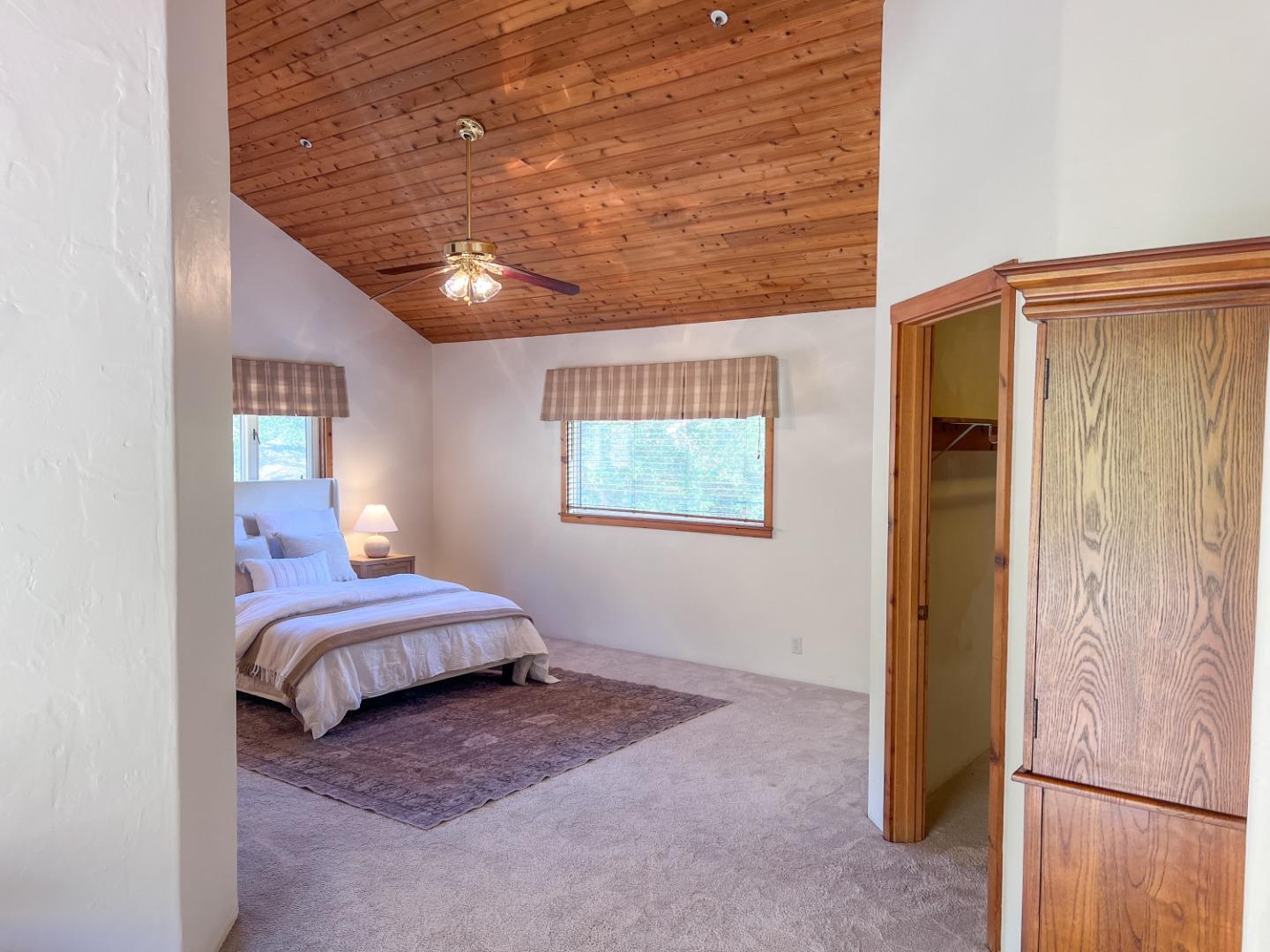 442 Corral De Tierra Road Salinas, CA 93908 - Photo 21 of 48 a bedroom with a bed and a chandelier