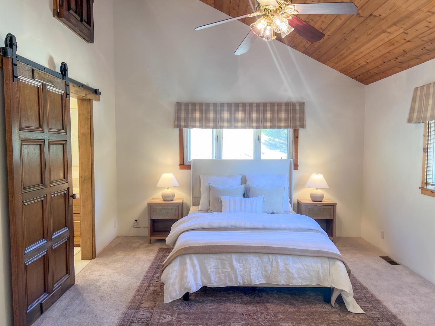 442 Corral De Tierra Road Salinas, CA 93908 - Photo 22 of 48 a bedroom with a bed and a chandelier