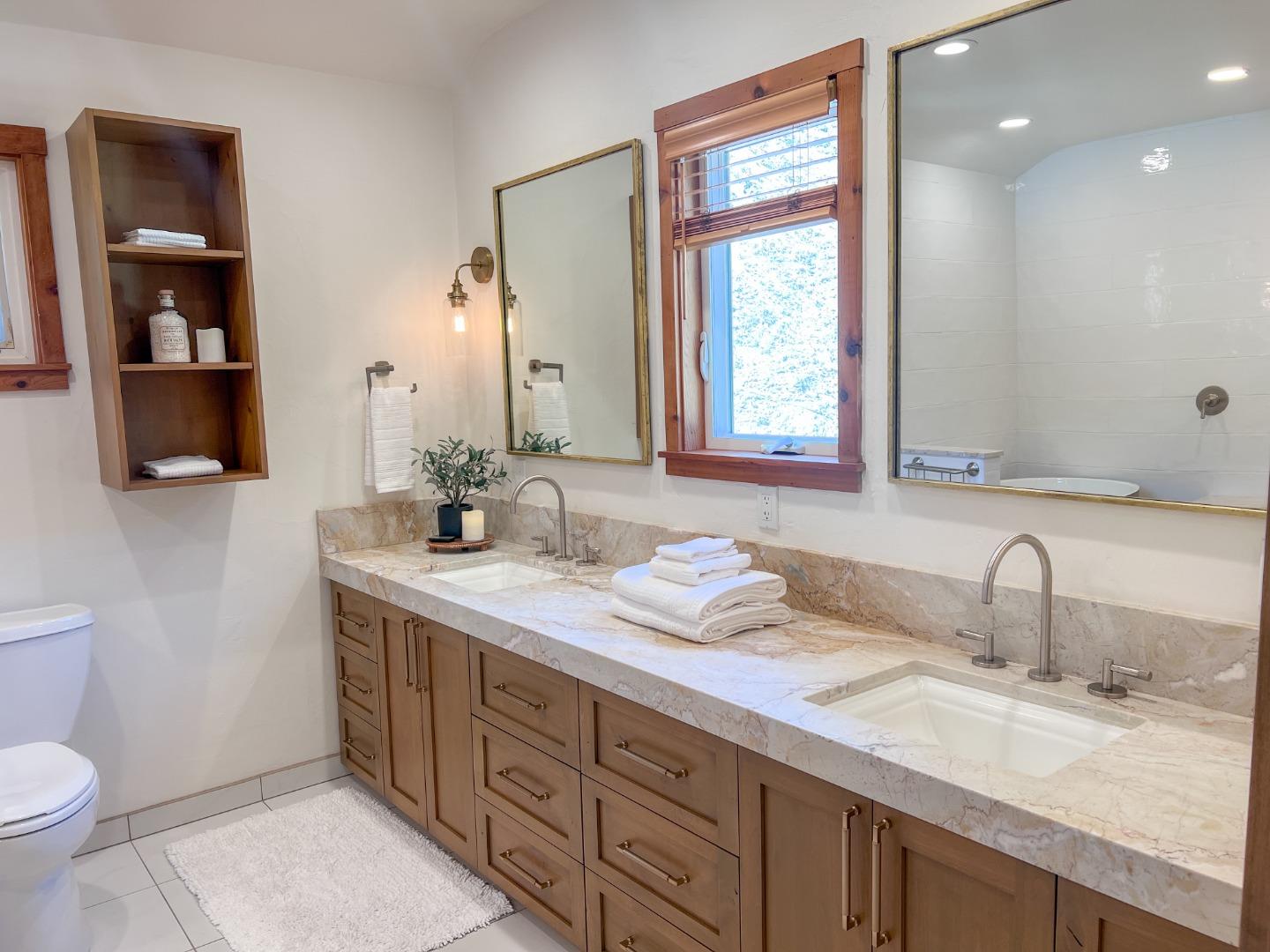 442 Corral De Tierra Road Salinas, CA 93908 - Photo 25 of 48 a bathroom with a double vanity sink and a mirror