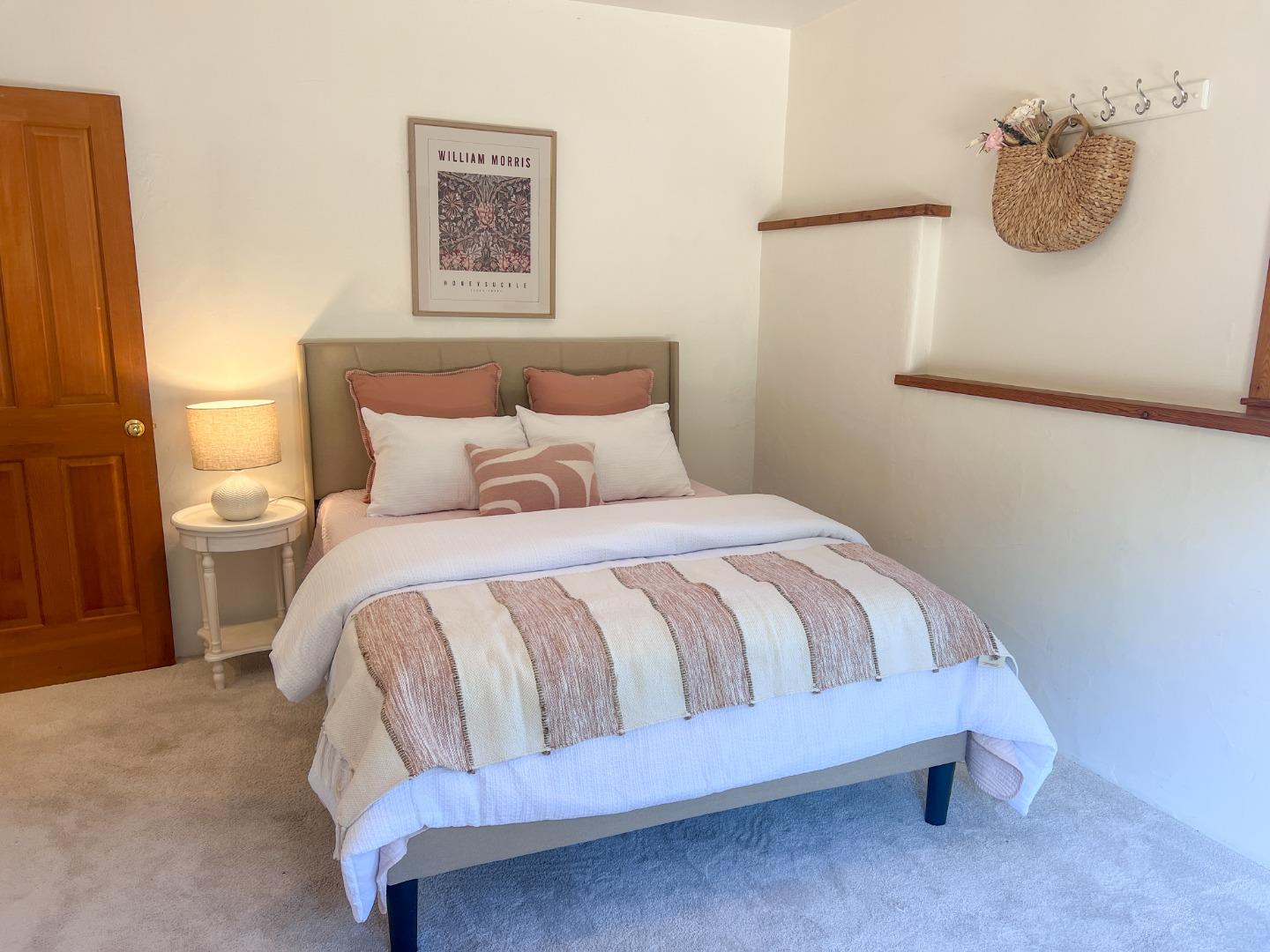 442 Corral De Tierra Road Salinas, CA 93908 - Photo 30 of 48 a bedroom with a bed and painting on the wall