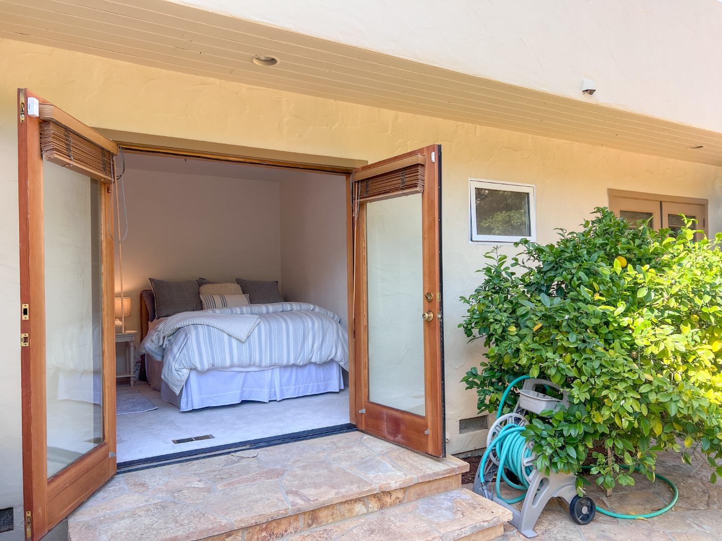 442 Corral De Tierra Road Salinas, CA 93908 - Photo 34 of 48 a bedroom with a bed and a potted plant