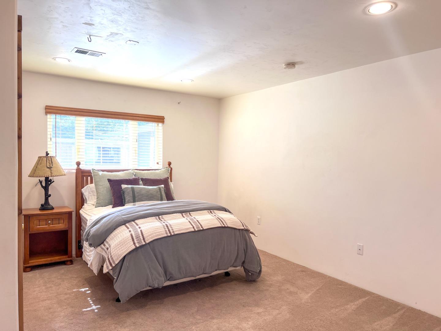 442 Corral De Tierra Road Salinas, CA 93908 - Photo 35 of 48 a bedroom with a bed and a window