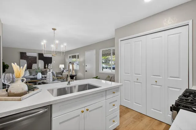 a kitchen with a sink and cabinets