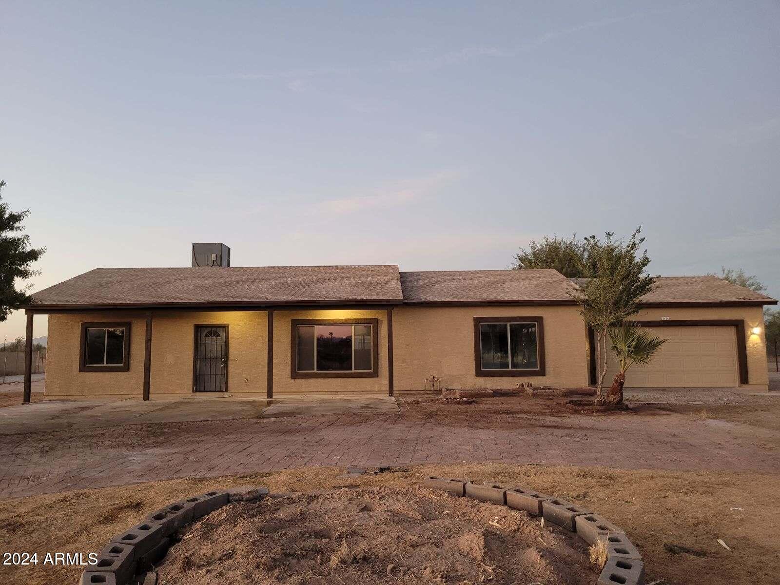 20526 West Teepee Road Buckeye, AZ 85326 - Photo 2 of 69 a house with a outdoor space