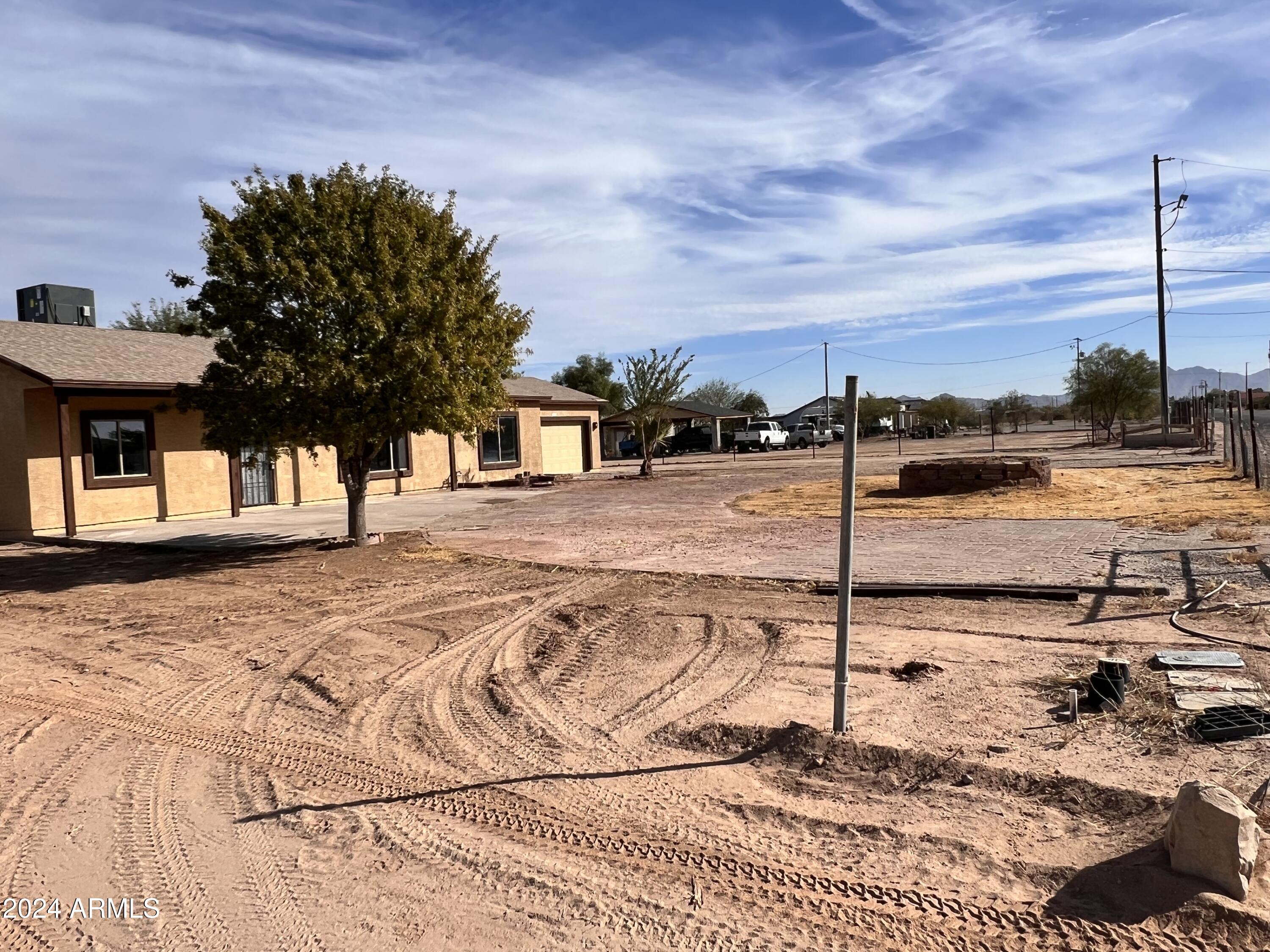 20526 West Teepee Road Buckeye, AZ 85326 - Photo 3 of 69 a view of a terrace with wooden floor and fence