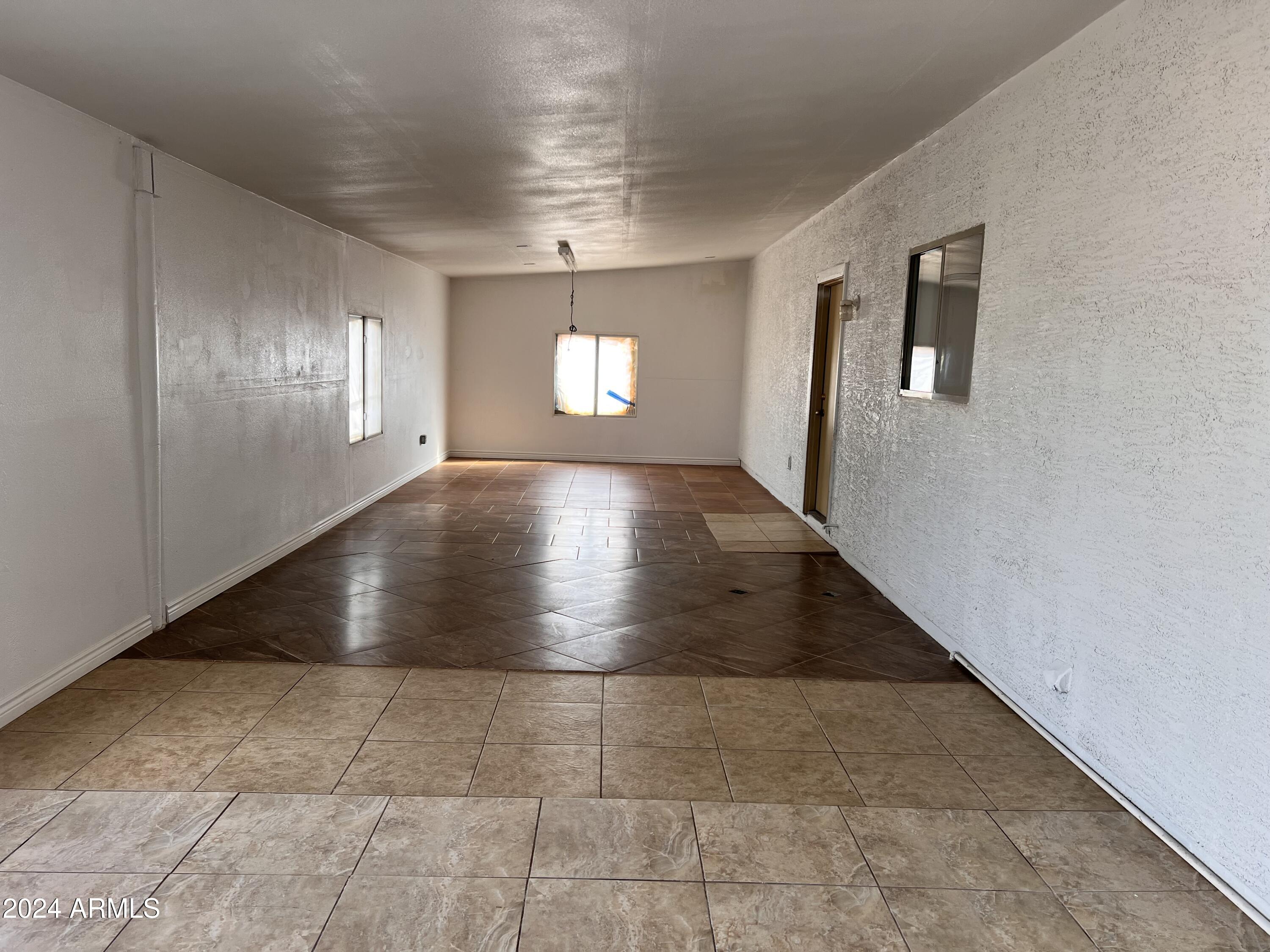 20526 West Teepee Road Buckeye, AZ 85326 - Photo 31 of 69 a view of an empty room with windows