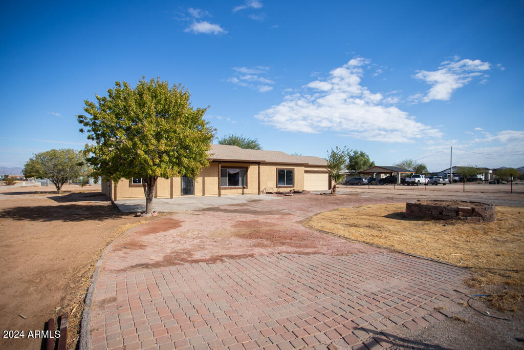 20526 West Teepee Road Buckeye, AZ 85326 - Photo 35 of 69 a view of a house with entertaining space