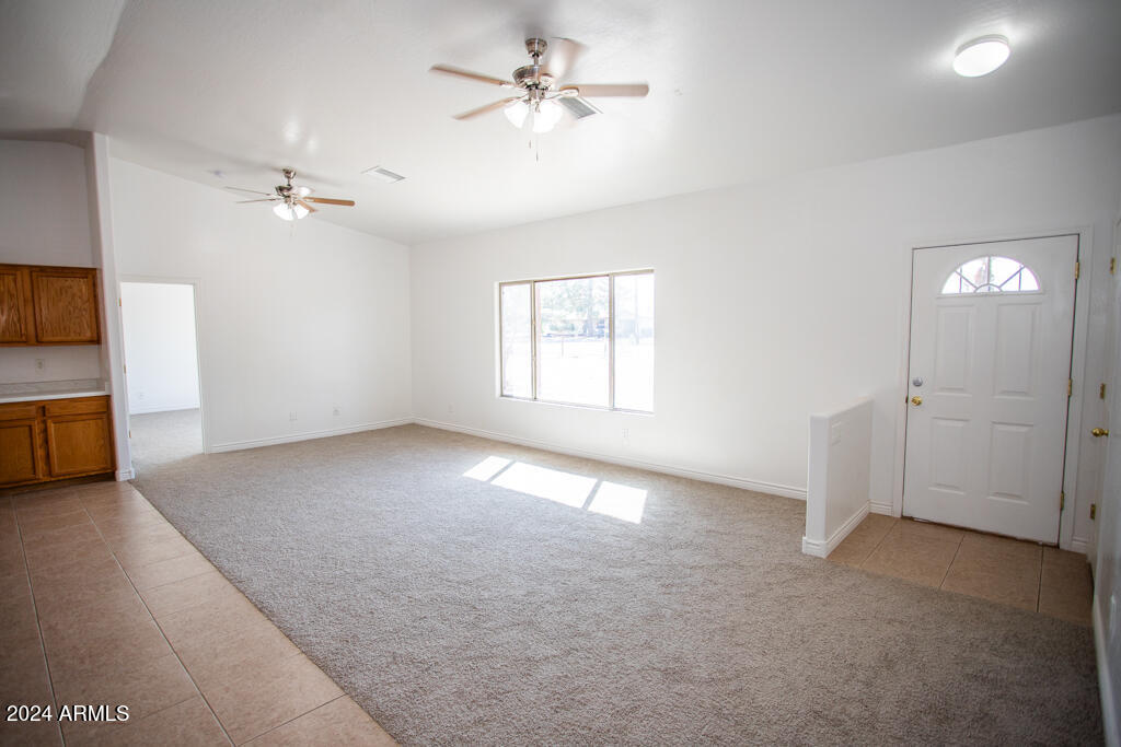 20526 West Teepee Road Buckeye, AZ 85326 - Photo 54 of 69 wooden floor in an empty room with a window