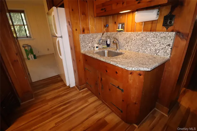 a view of a kitchen from the hallway