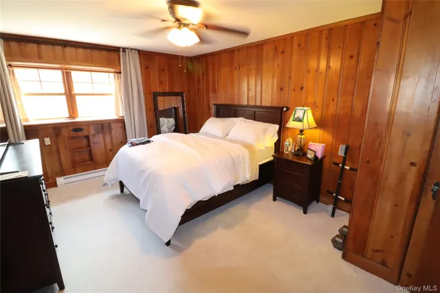 a bed sitting in a bedroom next to a walk in closet