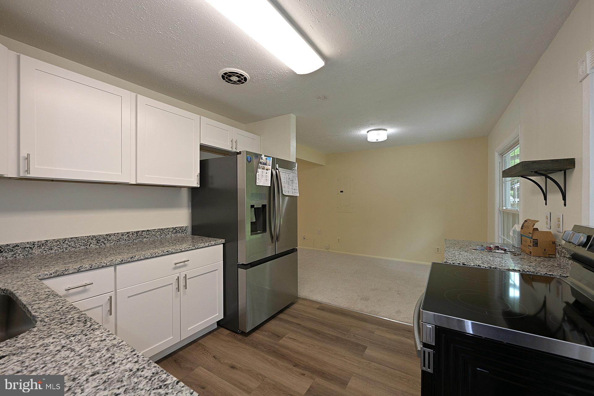 6728 Bowie Drive Springfield, VA 22150 - Photo 11 of 26 a kitchen with a sink appliances and cabinets