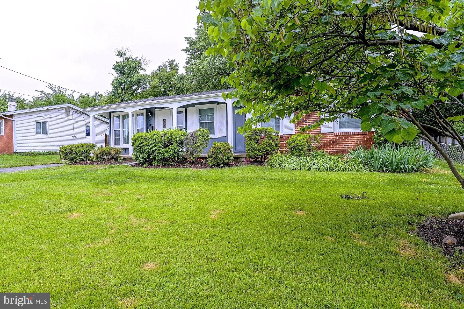 6728 Bowie Drive Springfield, VA 22150 - Photo 2 of 26 a front view of house with yard and green space