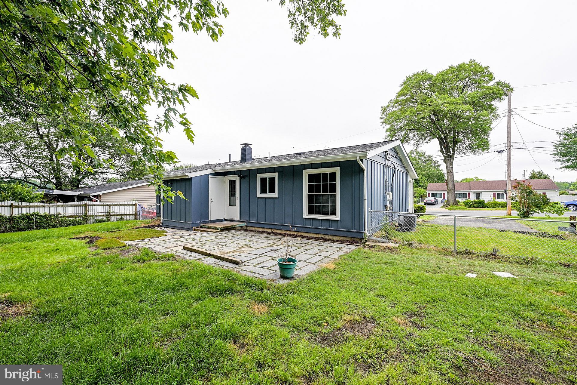 6728 Bowie Drive Springfield, VA 22150 - Photo 22 of 26 a backyard of a house with table and chairs
