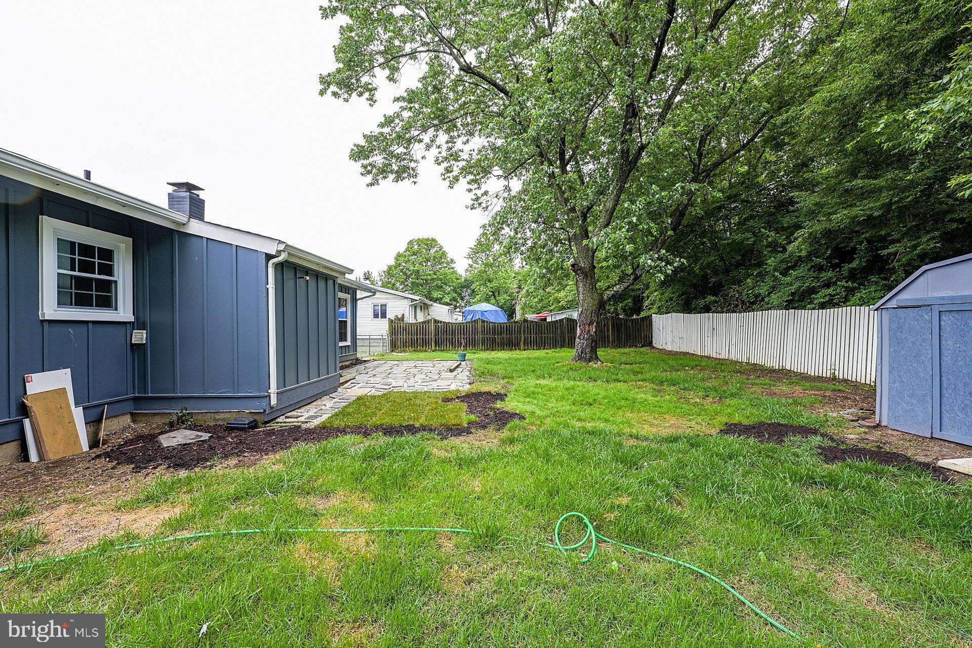 6728 Bowie Drive Springfield, VA 22150 - Photo 25 of 26 a backyard of a house with lots of green space
