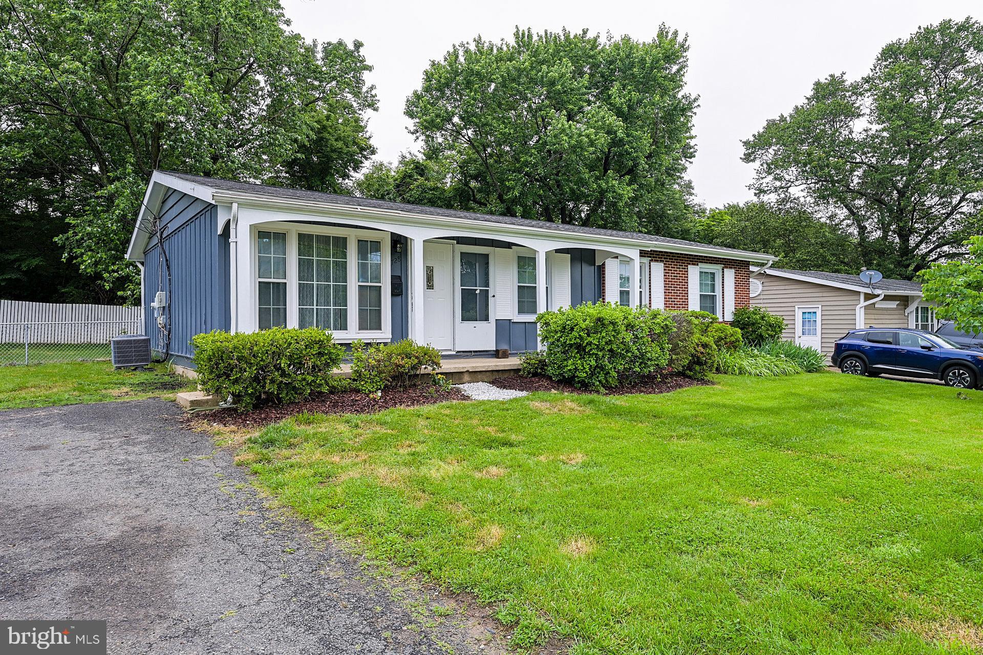 6728 Bowie Drive Springfield, VA 22150 - Photo 3 of 26 a view of a house with backyard and garden