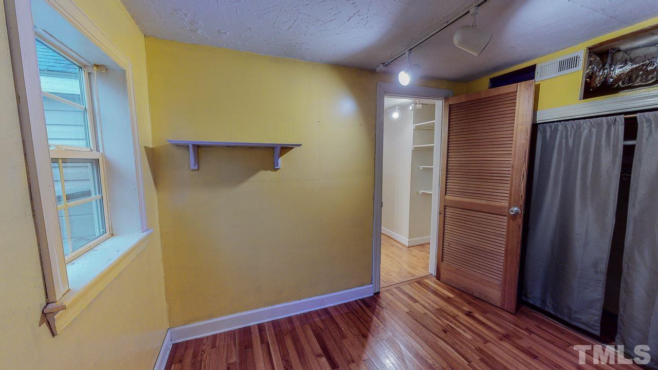 7065 Virgilina Road Roxboro, NC 27574 - Photo 22 of 28 a view of hallway with wooden floor