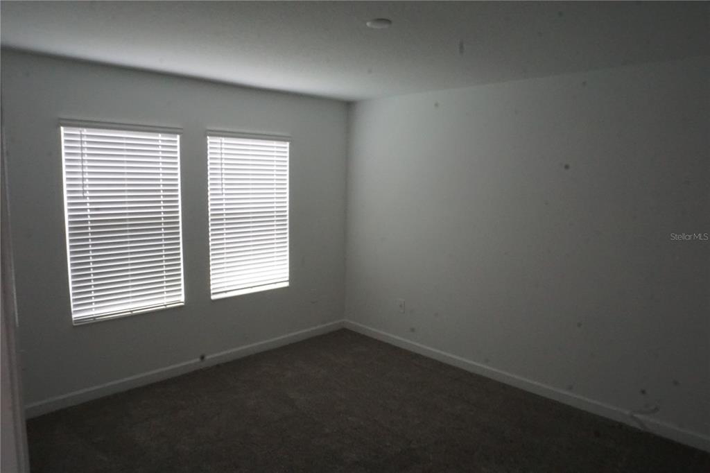 5704 Stephens Road St. Cloud, FL 34771 - Photo 7 of 12 an empty room with a window