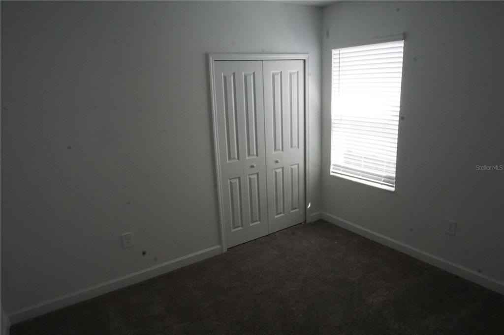5704 Stephens Road St. Cloud, FL 34771 - Photo 8 of 12 an empty room with windows