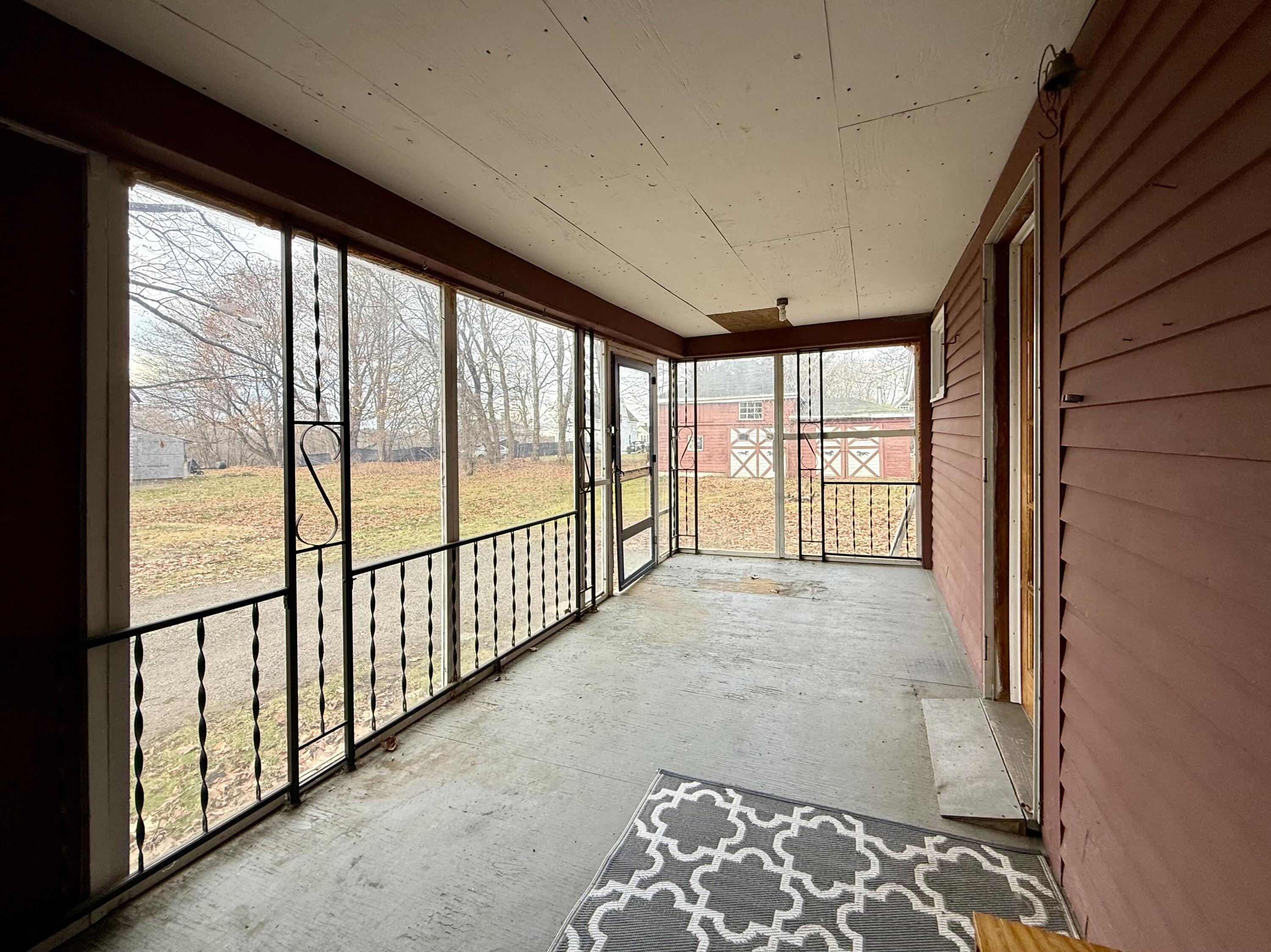 91 Downes Street Calais, ME 04619 - Photo 6 of 62 Another view of the enclosed porch