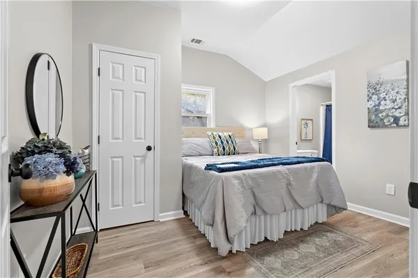 a bedroom with a bed and a dresser