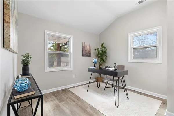 a workspace with furniture and window