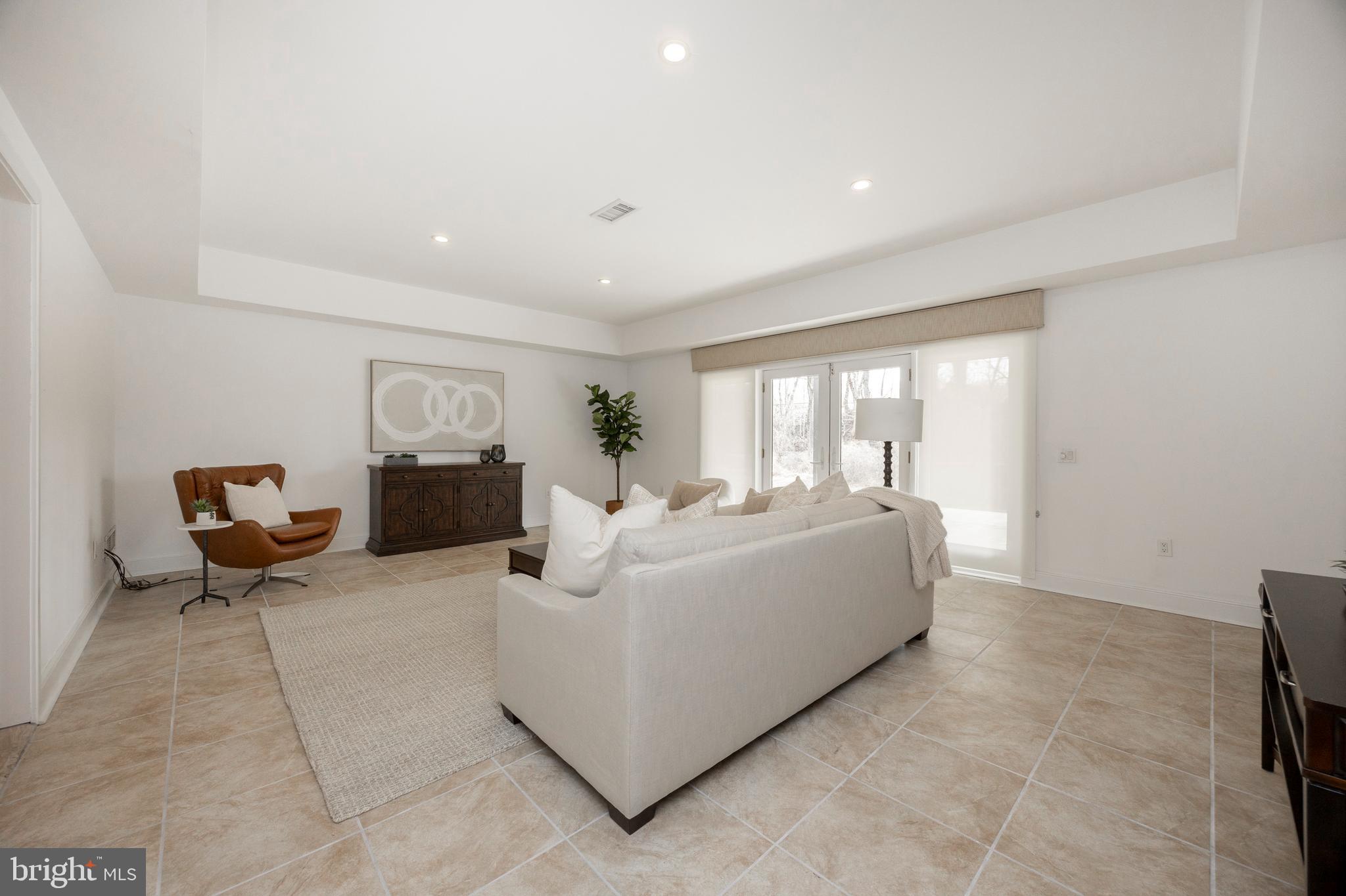 115 Bullock Road Chadds Ford, PA 19317 - Photo 34 of 50 a living room with furniture and a flat screen tv