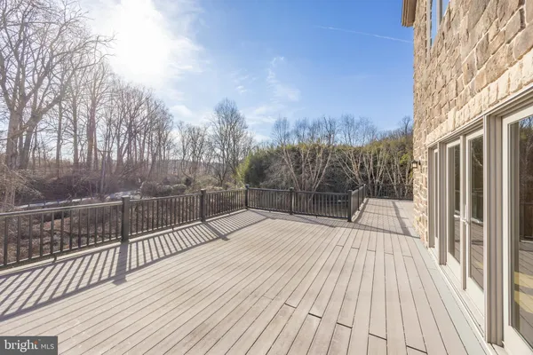 a view of backyard with a deck