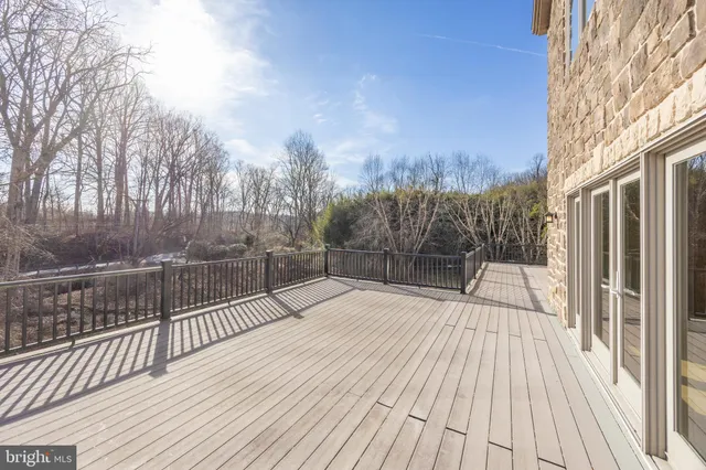 a view of backyard with a deck