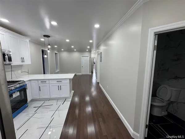 a kitchen with a sink stainless steel appliances and cabinets