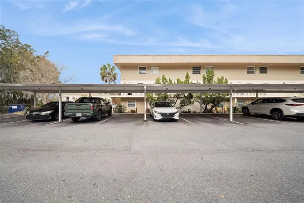 a view of parking space with cars parked