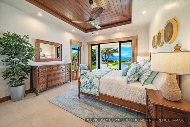 a bed room with a bed and a chandelier