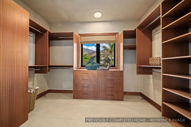 a large bathroom with a tub and window