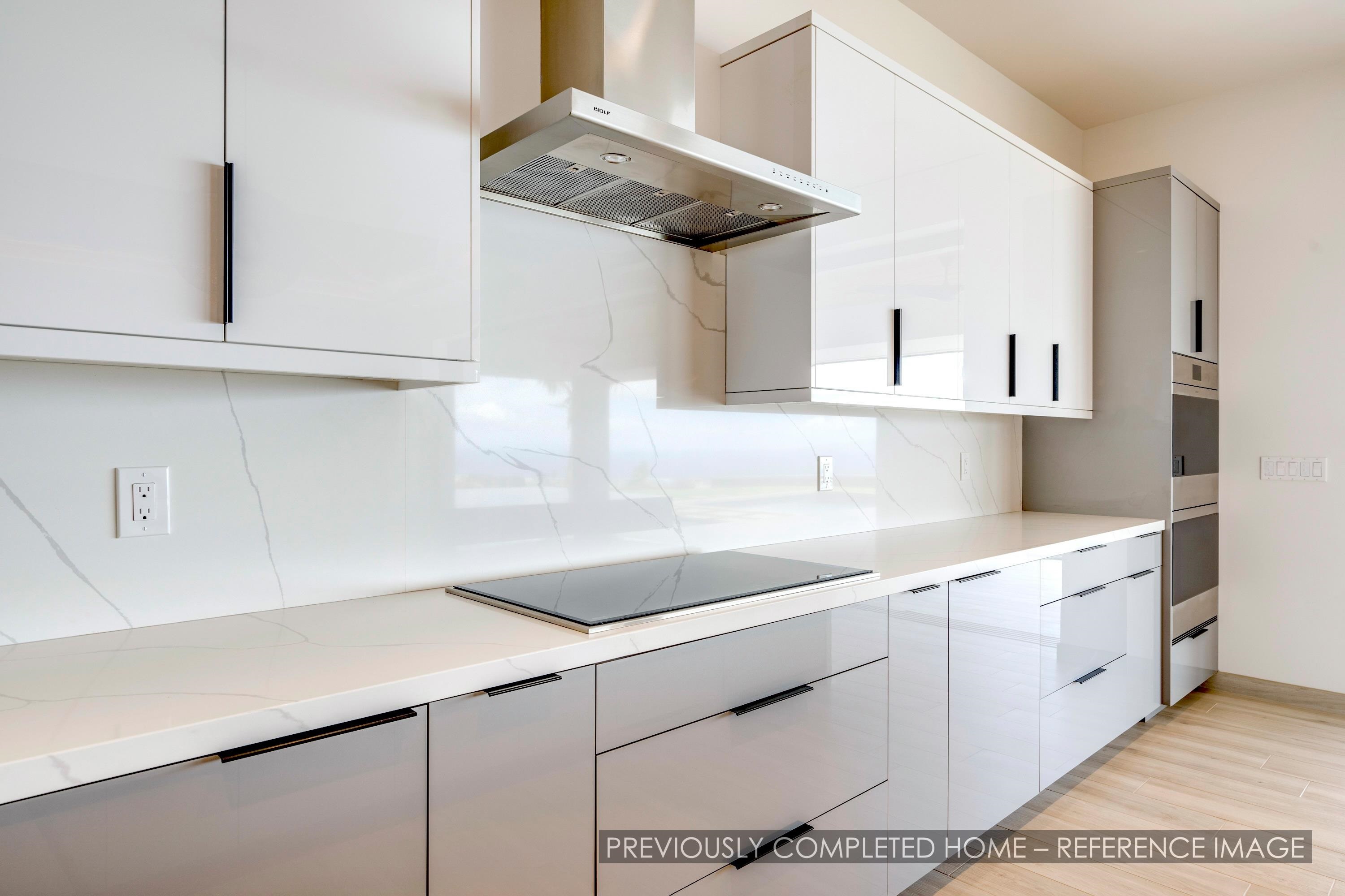 91 Kumu Niu Place, Unit A Lahaina, HI 96761 - Photo 30 of 48 a kitchen with a sink and cabinets