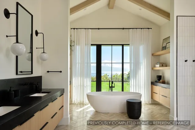 a bathroom with a shower sink and mirror