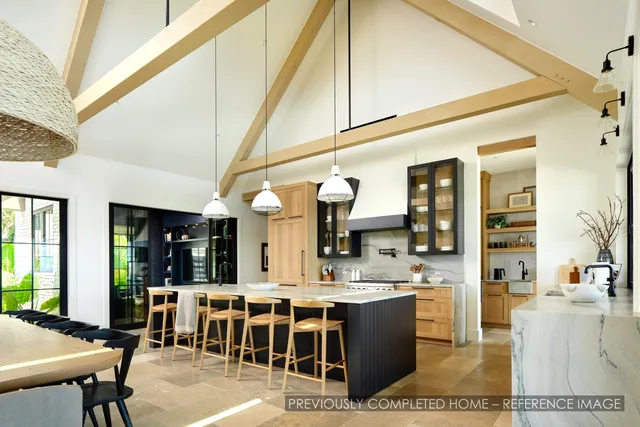 a bedroom with a bed and glass window