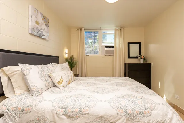 a bedroom with a bed and a cabinets